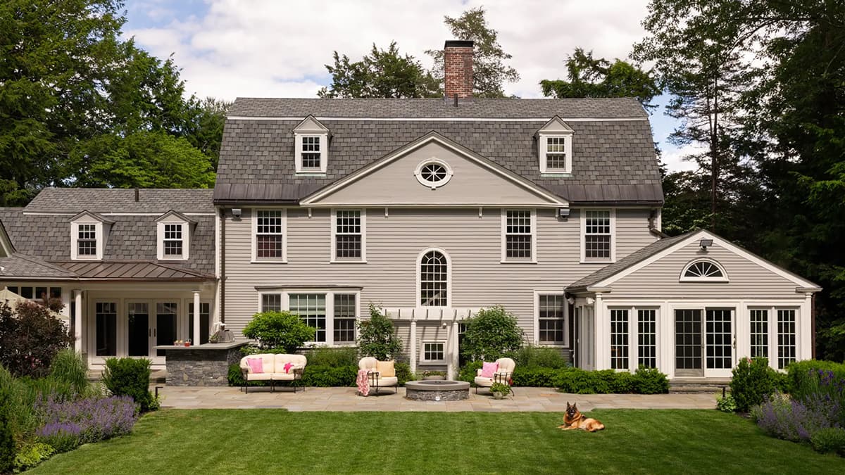 Rear elevation and landscaped terrace of the Belmont Residence in Belmont, Massachusetts