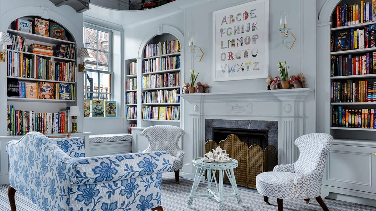 Children’s reading room at Beacon Hill Books & Café in Boston with custom built-in bookcases, fireplace, and historic architectural detailing