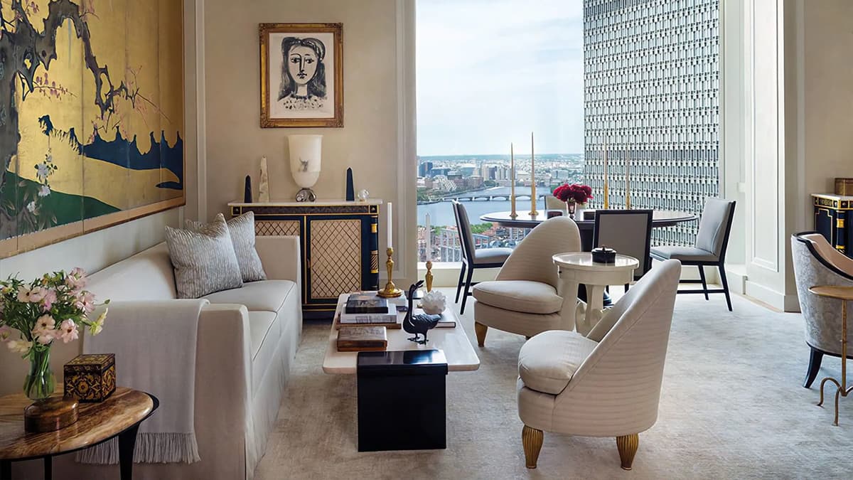 Interior living room at the One Dalton Street Residence in Boston with custom furnishings, architectural detailing, and expansive city views