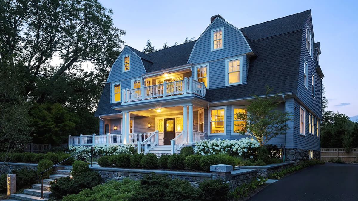 Historic renovated residence on Suffolk Road in Chestnut Hill, Massachusetts, with traditional detailing, porches, and landscaped grounds